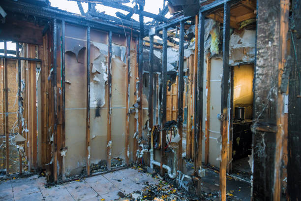Professional Fire Damage Restoration technician working in Helmetta, NJ